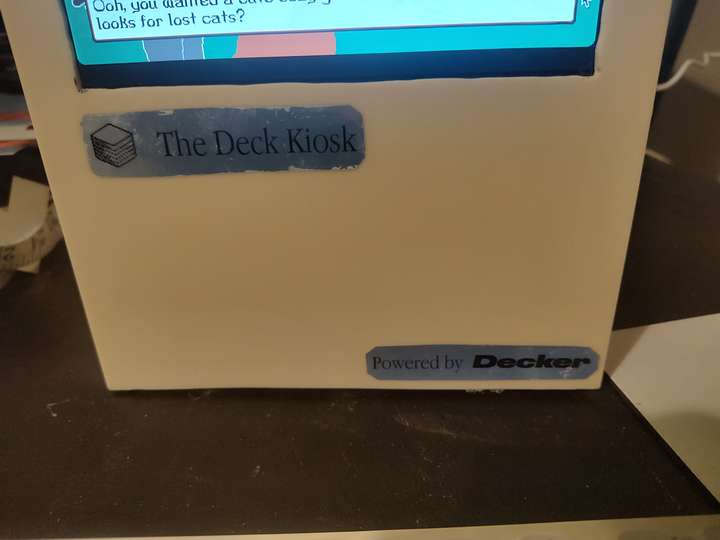 closeup of lower front panel, labels read 'The Deck Kiosk' and 'Powered by Decker'
